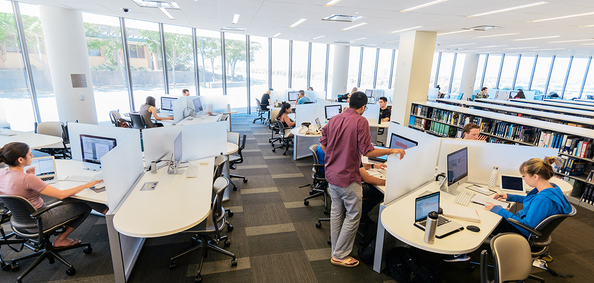 The Information Commons at the William H. Hannon Library with students working on computers..