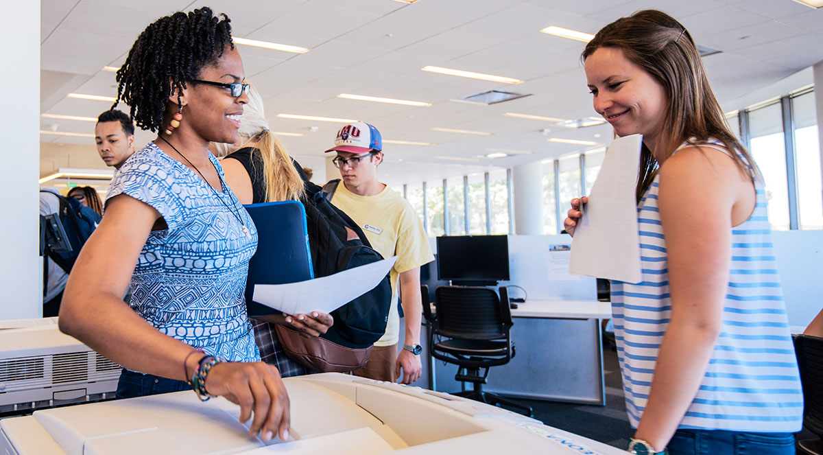 Students at the Information Commons printer