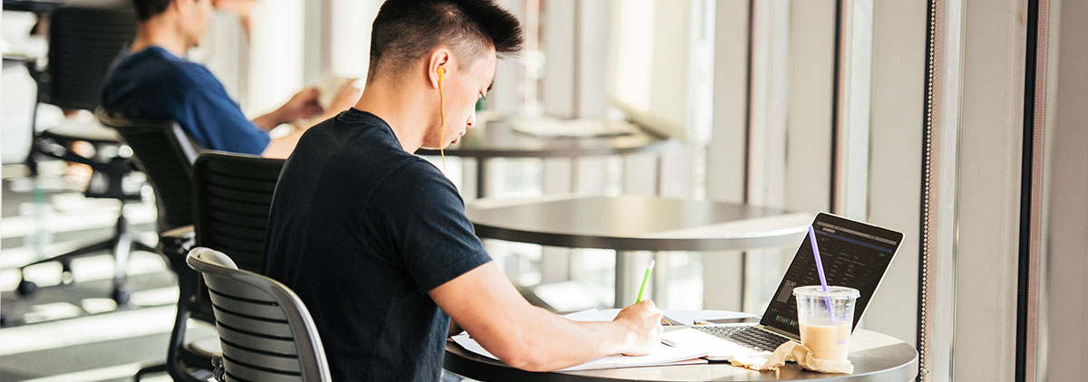 Student studying in the library. 